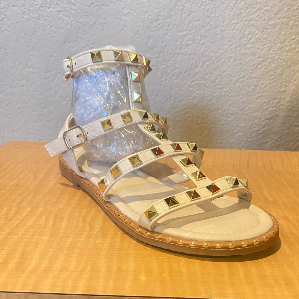 Gladiator sandal with gold spiked pyramids.